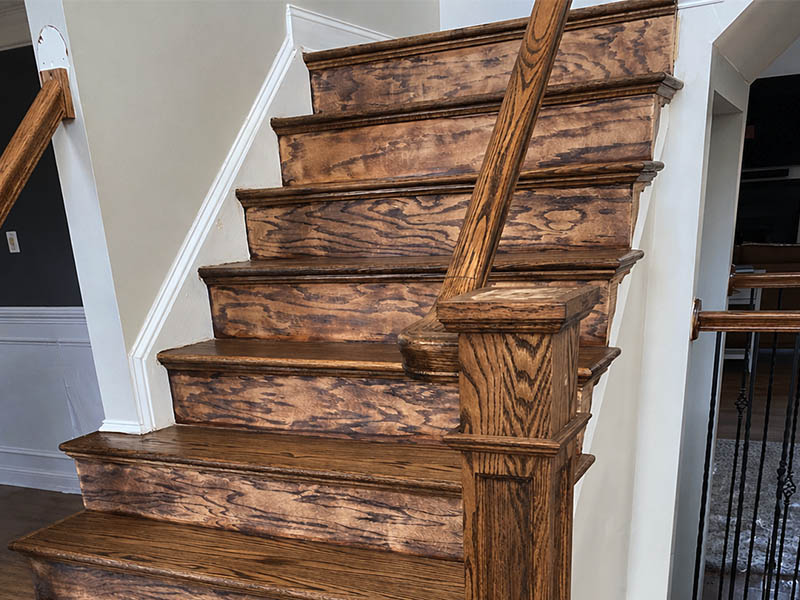 Closeup of new wood staircase with fresh staining.