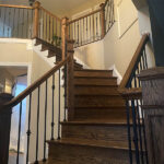 Custom staircase with dark wood finish by Darby Stair Renovations.