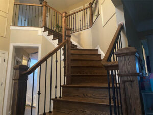 Custom staircase with dark wood finish by Darby Stair Renovations.