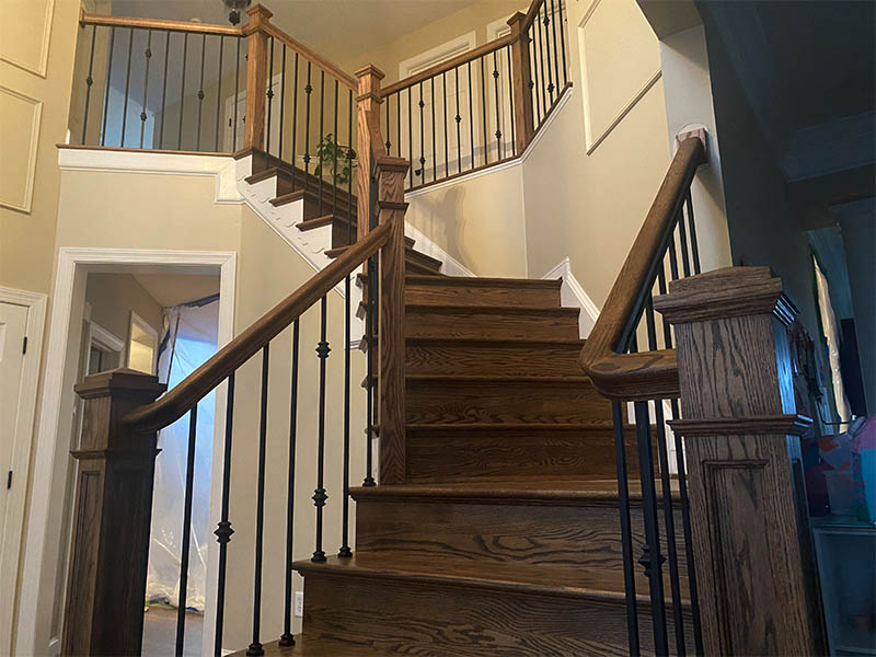 Custom staircase with dark wood finish by Darby Stair Renovations.